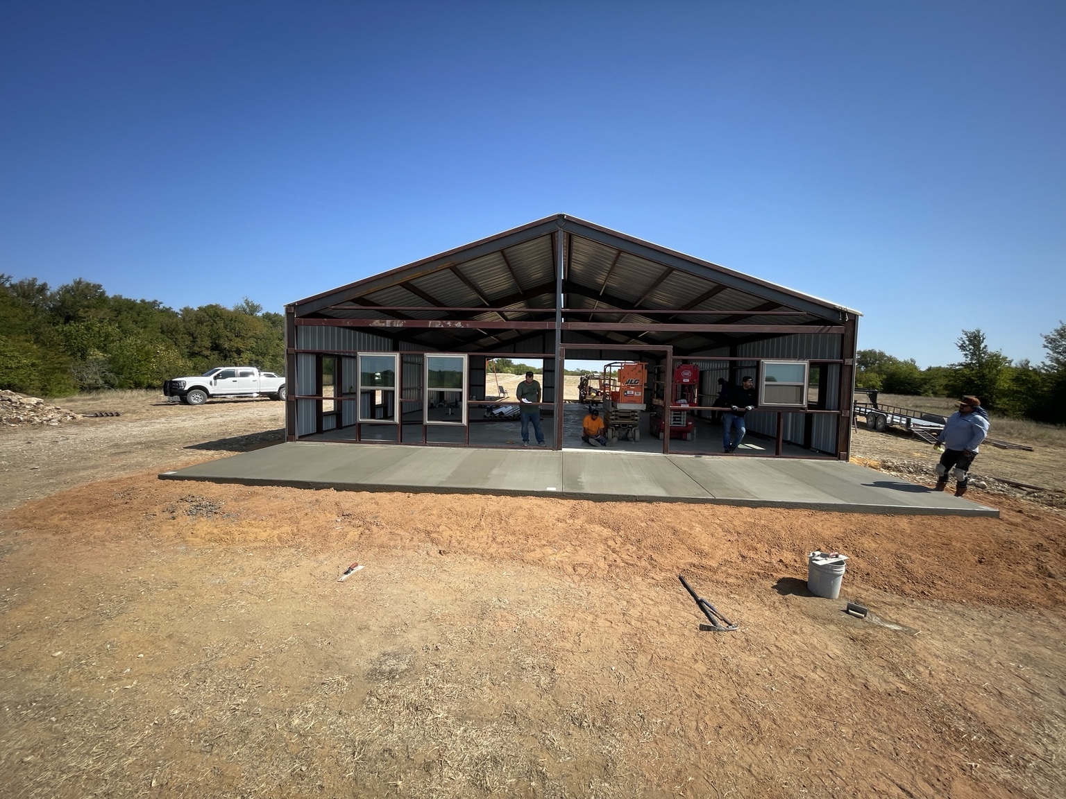 Concrete slab in front of a metal shop building